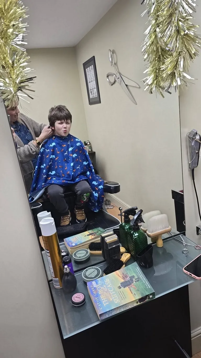 Andy & Marvin's barber chair and salon interior